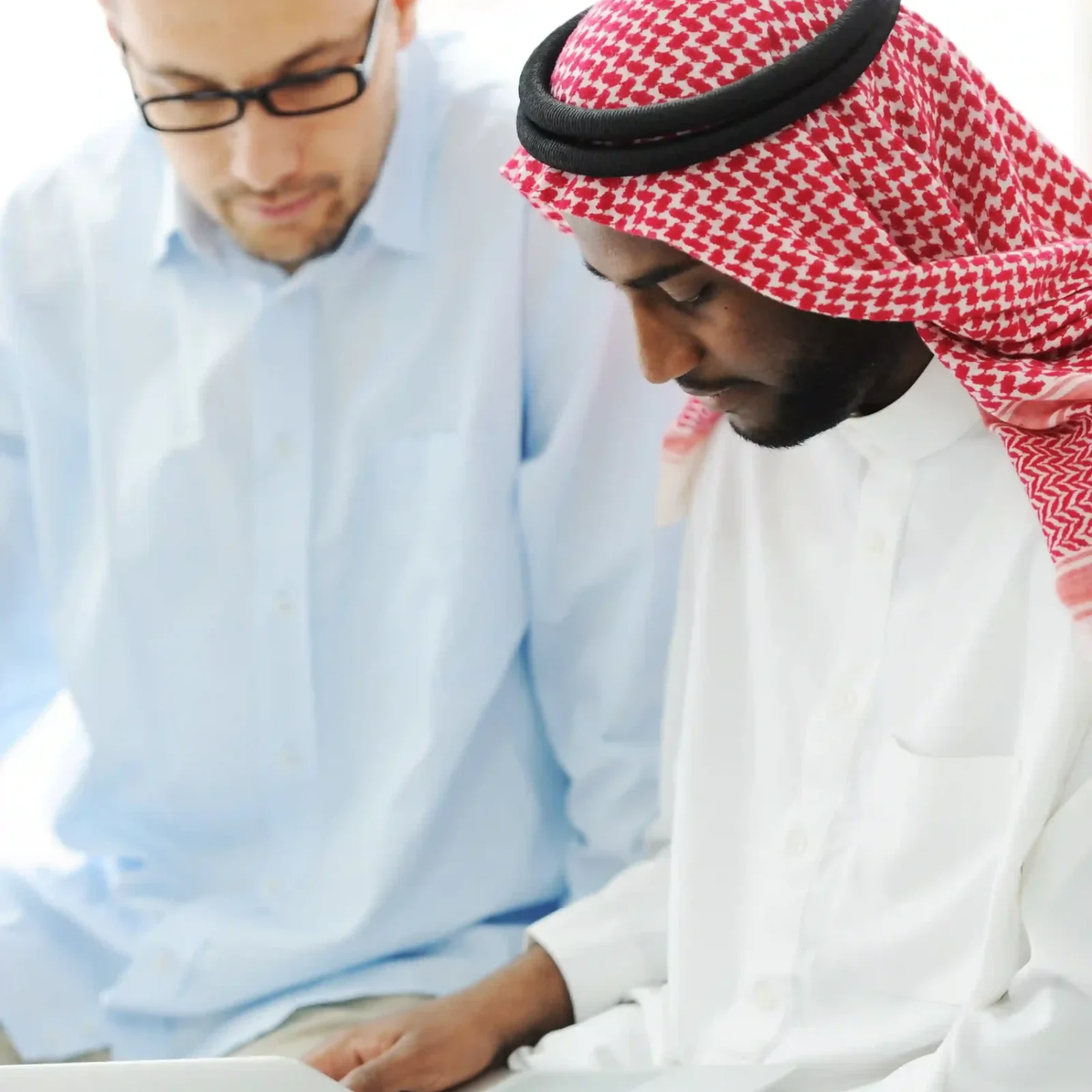 arabic-black-caucasian-men-working-together-laptop_resized